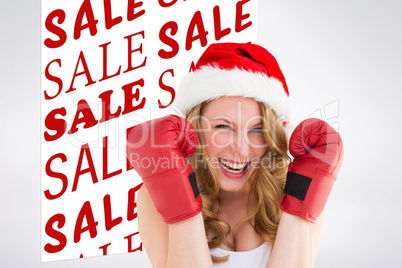 Composite image of blonde woman wearing boxing gloves smiling at