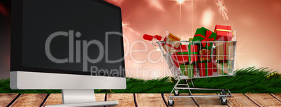 Composite image of trolley full of gifts