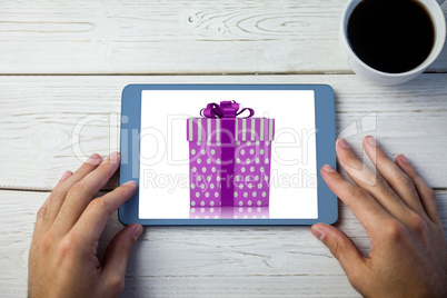 Composite image of purple and silver gift box