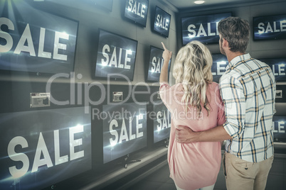 Composite image of attractive couple standing and looking