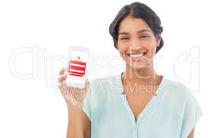 Composite image of businesswoman showing mobile phone over white