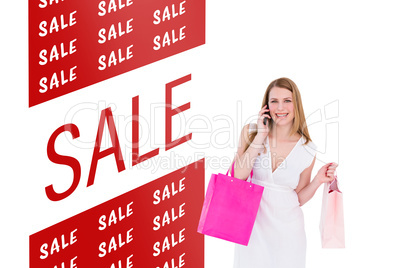 Composite image of happy blonde holding shopping bags and talkin