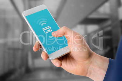 Composite image of businessman using mobile phone over white bac