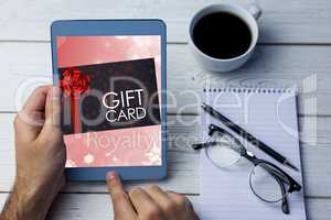 Composite image of gift card with festive bow