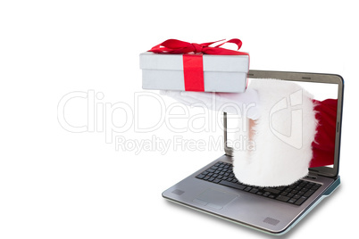 Composite image of santa claus showing gift with red ribbon