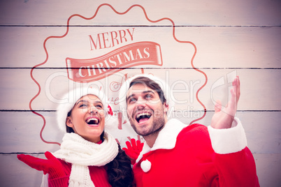 Composite image of festive young couple