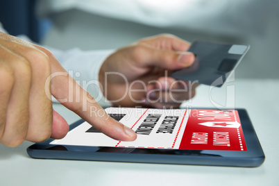 Composite image of man using tablet