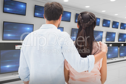 Composite image of attractive young couple standing and looking