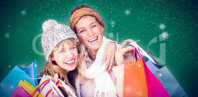 Composite image of smiling women looking at camera with shopping