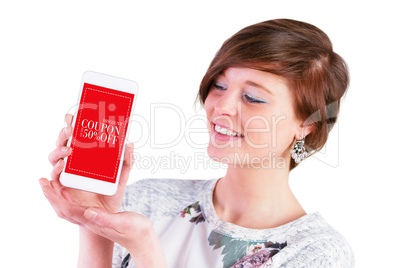 Composite image of smiling woman showing smart phone with blank