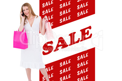 Composite image of happy blonde holding shopping bags and talkin