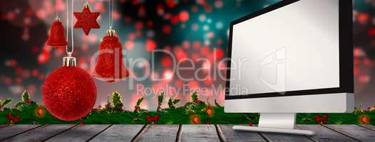 Composite image of red christmas bell decoration hanging
