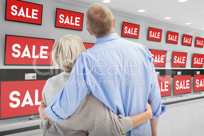 Composite image of mature couple hugging and looking