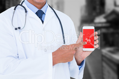 Composite image of midsection of male doctor pointing on mobile