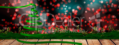 Composite image of green christmas tree ribbon