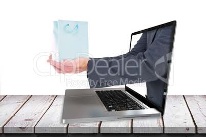 Composite image of businessman holding his hands out