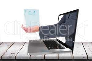 Composite image of businessman holding his hands out