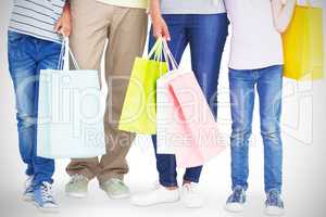 Family with shopping bags gesturing thumbs up