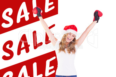 Composite image of festive blonde with boxing gloves