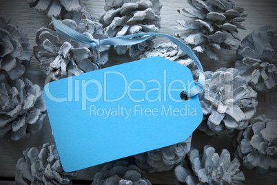 Light Blue Label On Fir Cones With Copy Space Frame