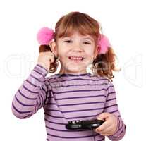 happy little girl play video game and win