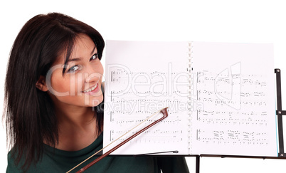 girl and notebook for musical notes