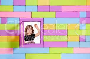 little girl greeting on window