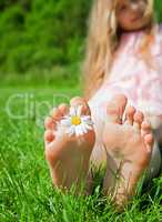 feet of a child with flower