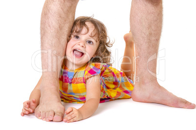 Little daughter at the feet of her father