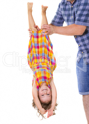 Happy little girl upside down