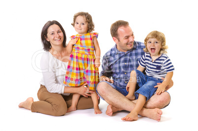 Happy family of four smiling