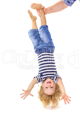 Little boy upside down
