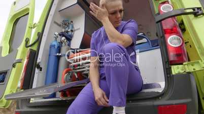 Emergency medical ambulance service stressed paramedic working 24-hour shift