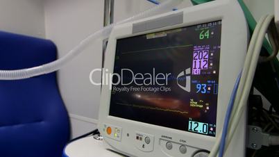 Screen of multiparameter ambulance patient monitor indicates high blood pressure