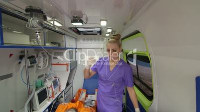 EMT provide emergency medical care to patient in ambulance intravenous infusion