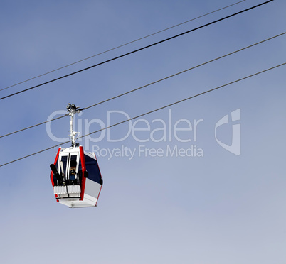 Gondola lift with ski and snowboards