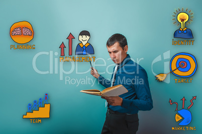 businessman reading a book man frowned and shows a pencil on a c