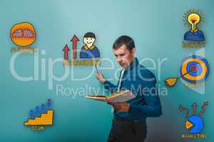 businessman reading a book man frowned and shows a pencil on a c