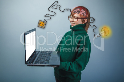 Teenage boy in glasses holding a laptop charging cord plug wire