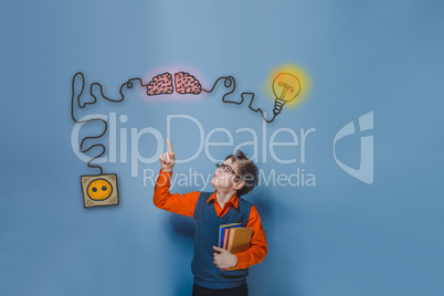 Teenage boy in glasses holding books showing thumb up charging c