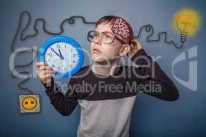 Teenage boy scratching his head and holding a clock booster char
