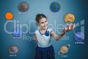 teen girl smiling and holding a news space planet Mars planet of