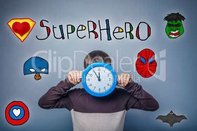 Teen boy covered his face with clock keeps their hands superhero