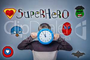 Teen boy covered his face with clock keeps their hands superhero