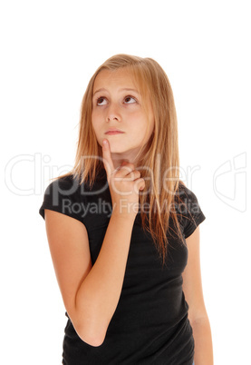 Young girl holding finger on chin.