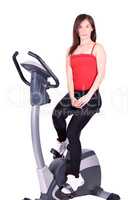 fitness girl with cross trainer posing
