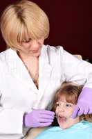 female dentist and little girl patient