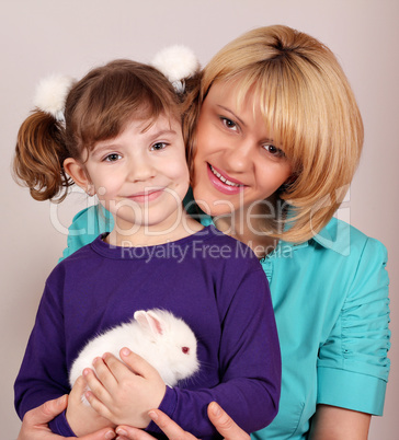 mother and daughter with dwarf white bunny