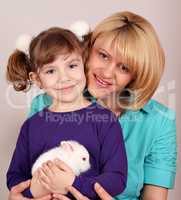 mother and daughter with dwarf white bunny