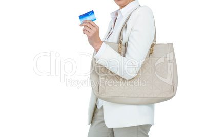 Smiling woman with a credit card in hand